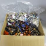 A large box of costume jewellery and three bags