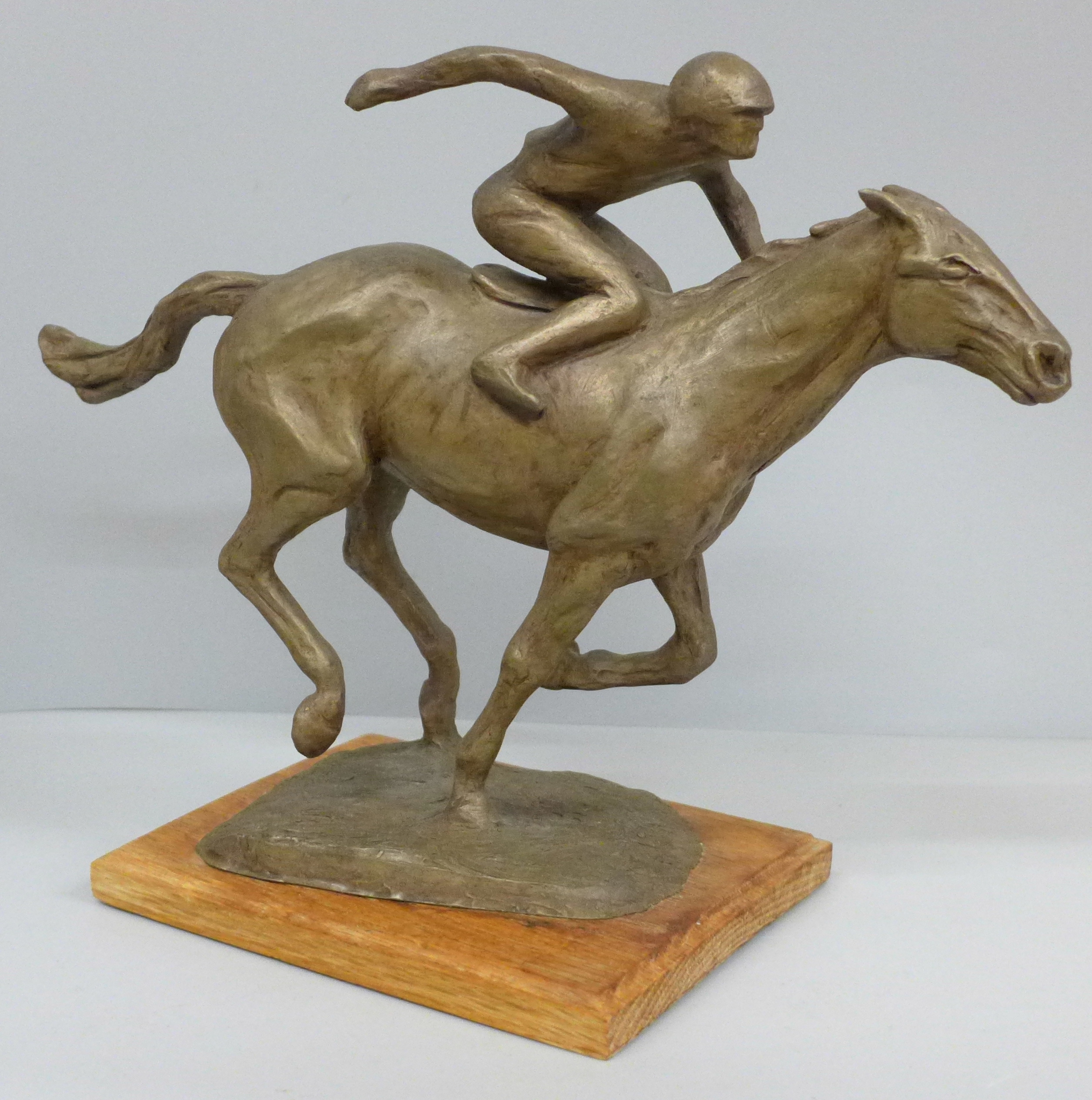 A horse and jockey sculpture by Jacqueline E. Hodges, hand sculptured and individually cast, limited