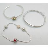 Two silver bangles and a Pandora bracelet