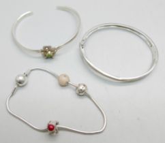 Two silver bangles and a Pandora bracelet