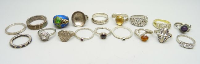Eleven silver rings and seven white metal rings, one lacking stone, 75g