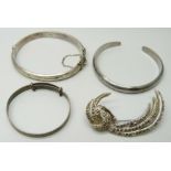 Two silver bangles, one other bangle and a marcasite set brooch