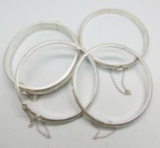 Four silver bangles, 40g
