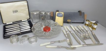 A pierced dish, dessert knives and forks, glass jars, a pair of French opera glasses, guilloche