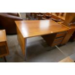 A teak and chrome desk