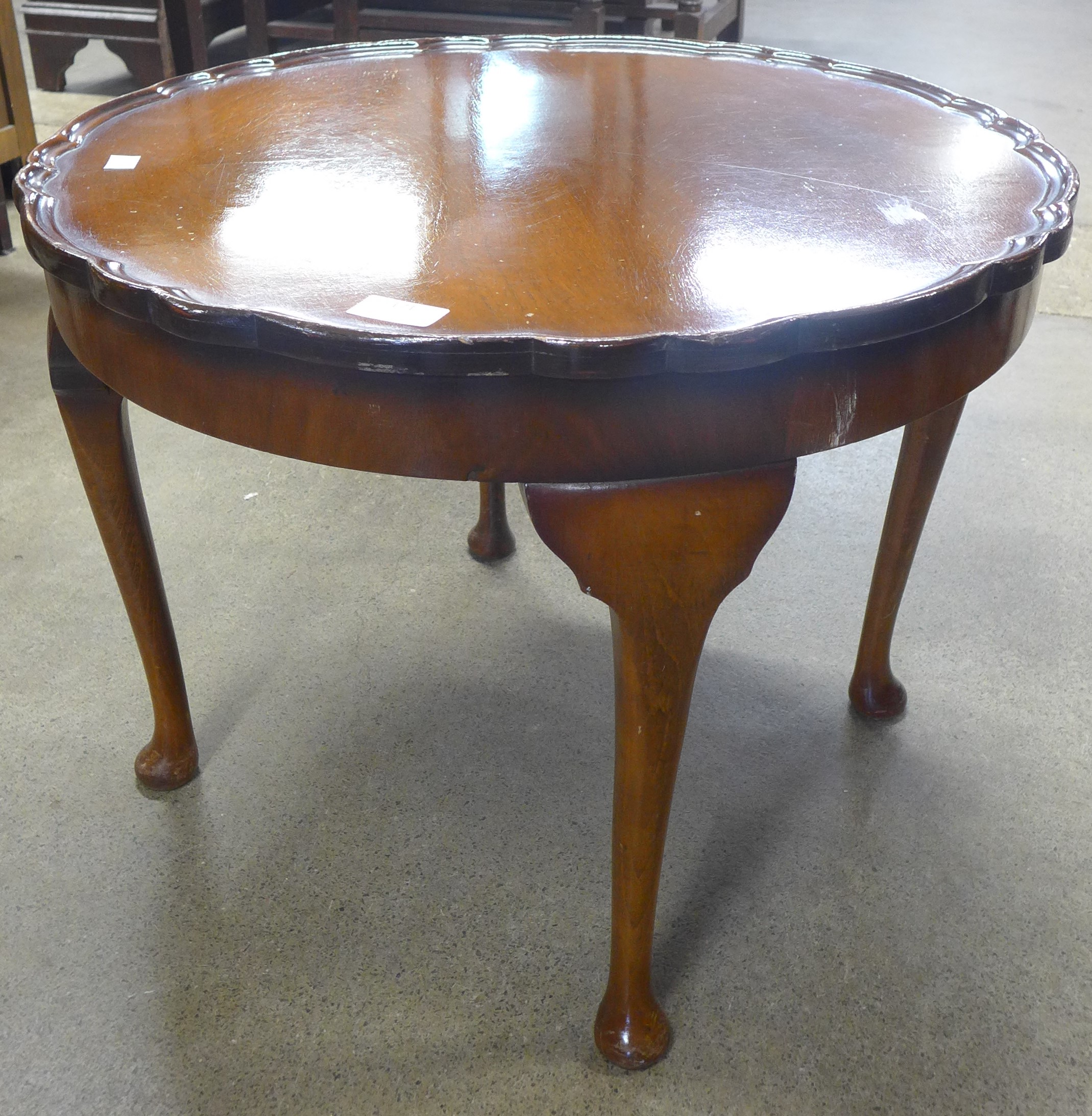 A Queen Anne style walnut coffee table