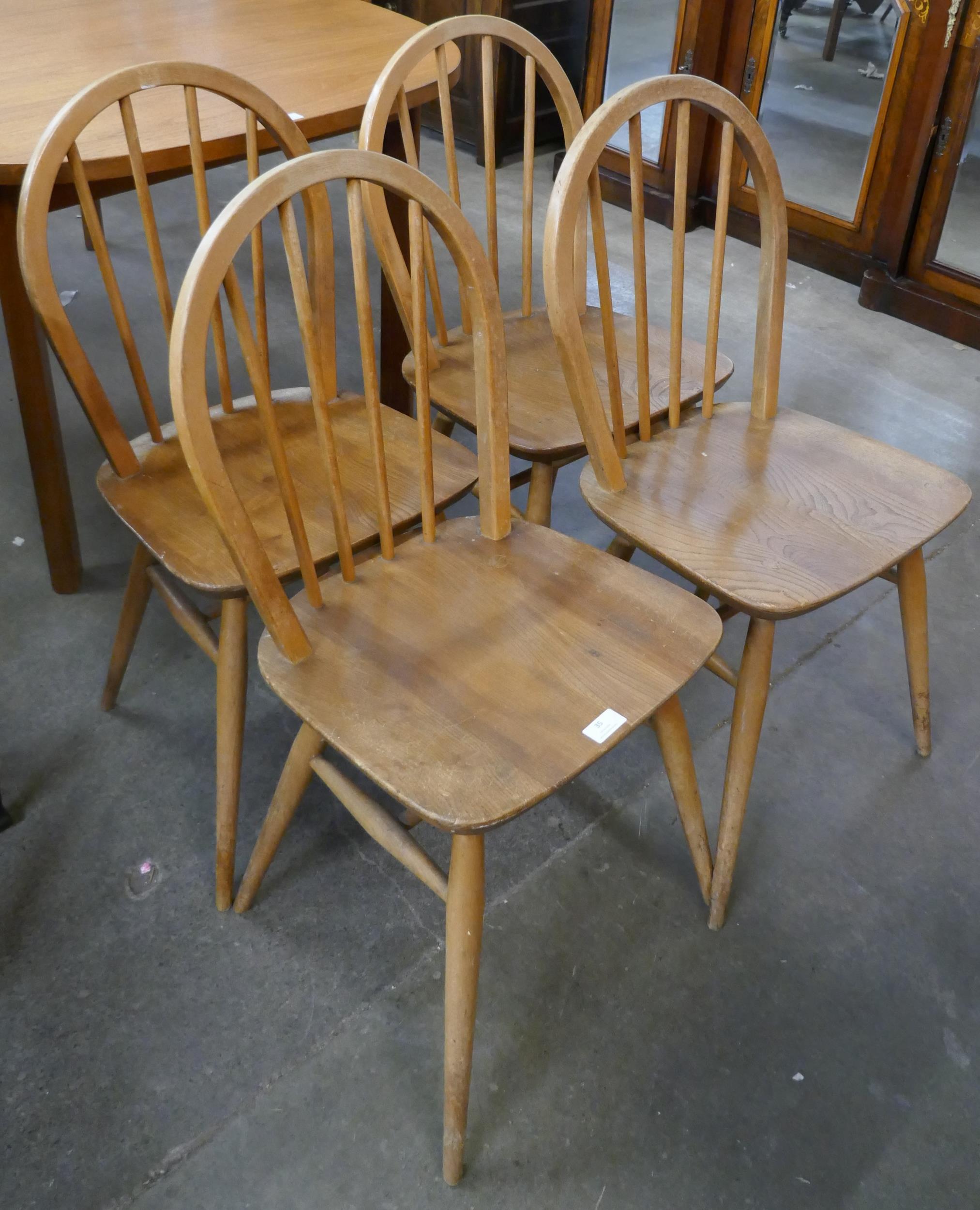 A set of four Ercol Blonde elm and beech Windsor chairs