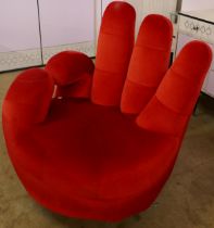 A red fabric OK hand shaped chair