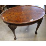 A Queen Anne style burr walnut oval coffee table