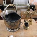 A coal scuttle and a set of fire accessories with ship design