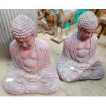 A pair of concrete garden figures of Buddhas