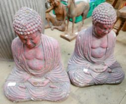 A pair of concrete garden figures of Buddhas