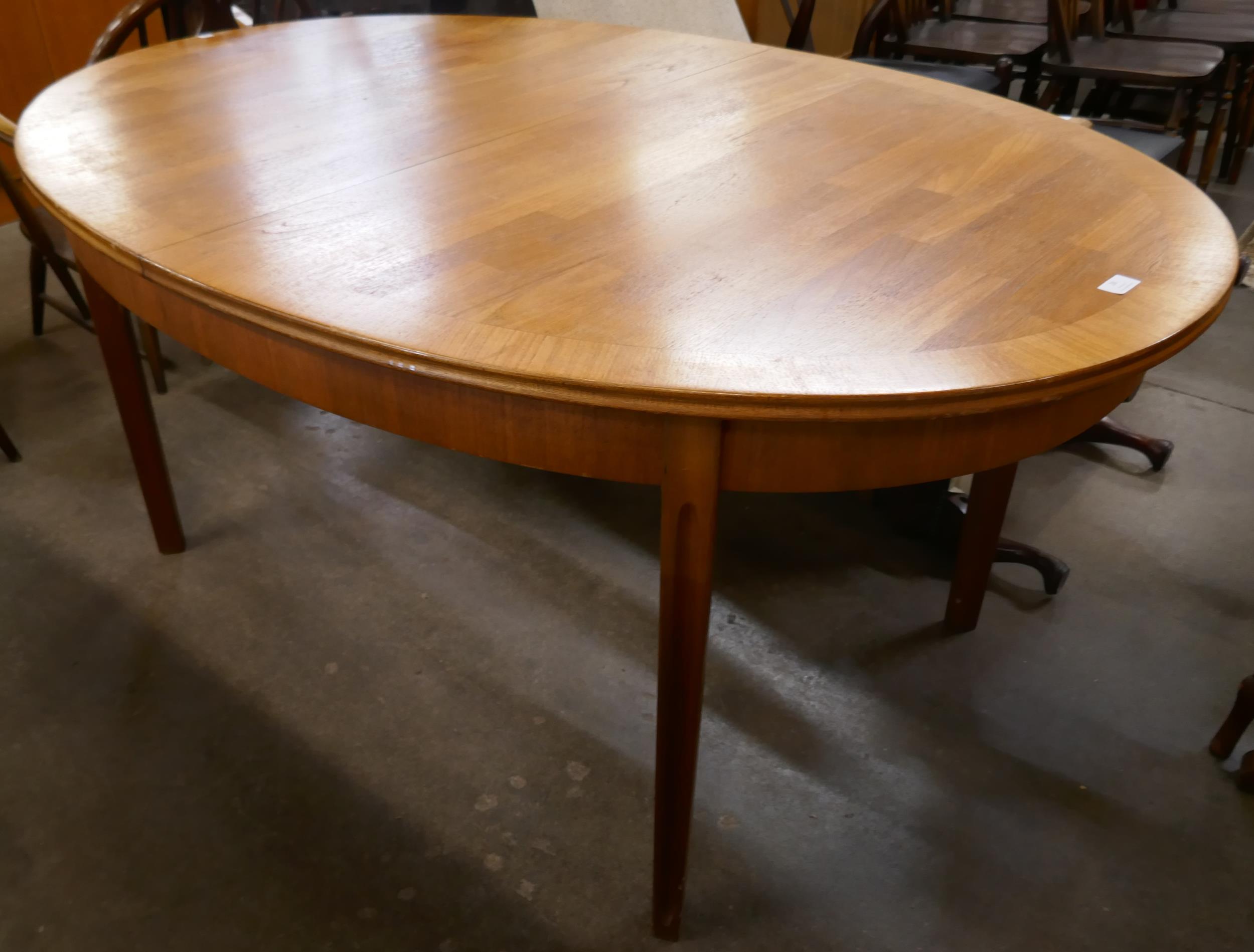 A William Lawrence teak oval extending dining table