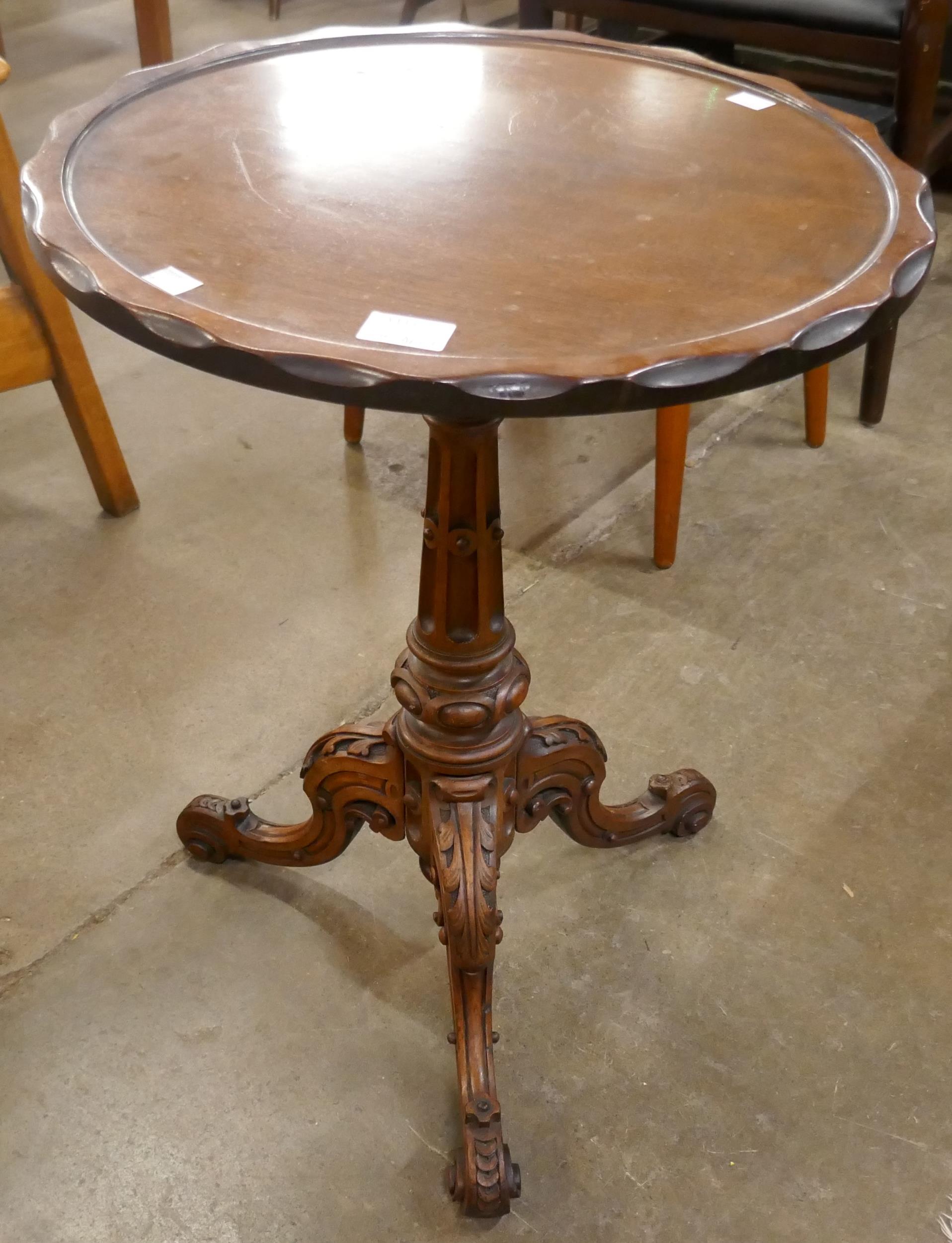 A Chippendale style carved mahogany tripod wine table