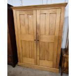 A Victorian pine two door housekeepers cupboard