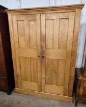 A Victorian pine two door housekeepers cupboard
