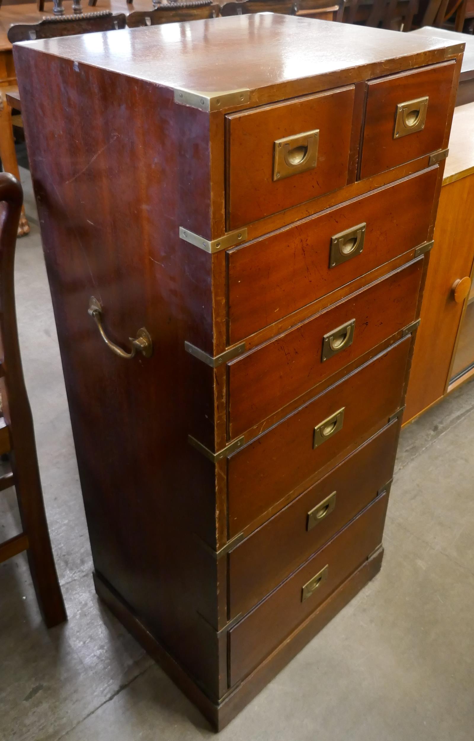 A campaign style mahogany and brass mounted chest of drawers