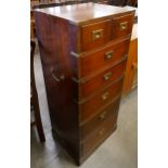 A campaign style mahogany and brass mounted chest of drawers