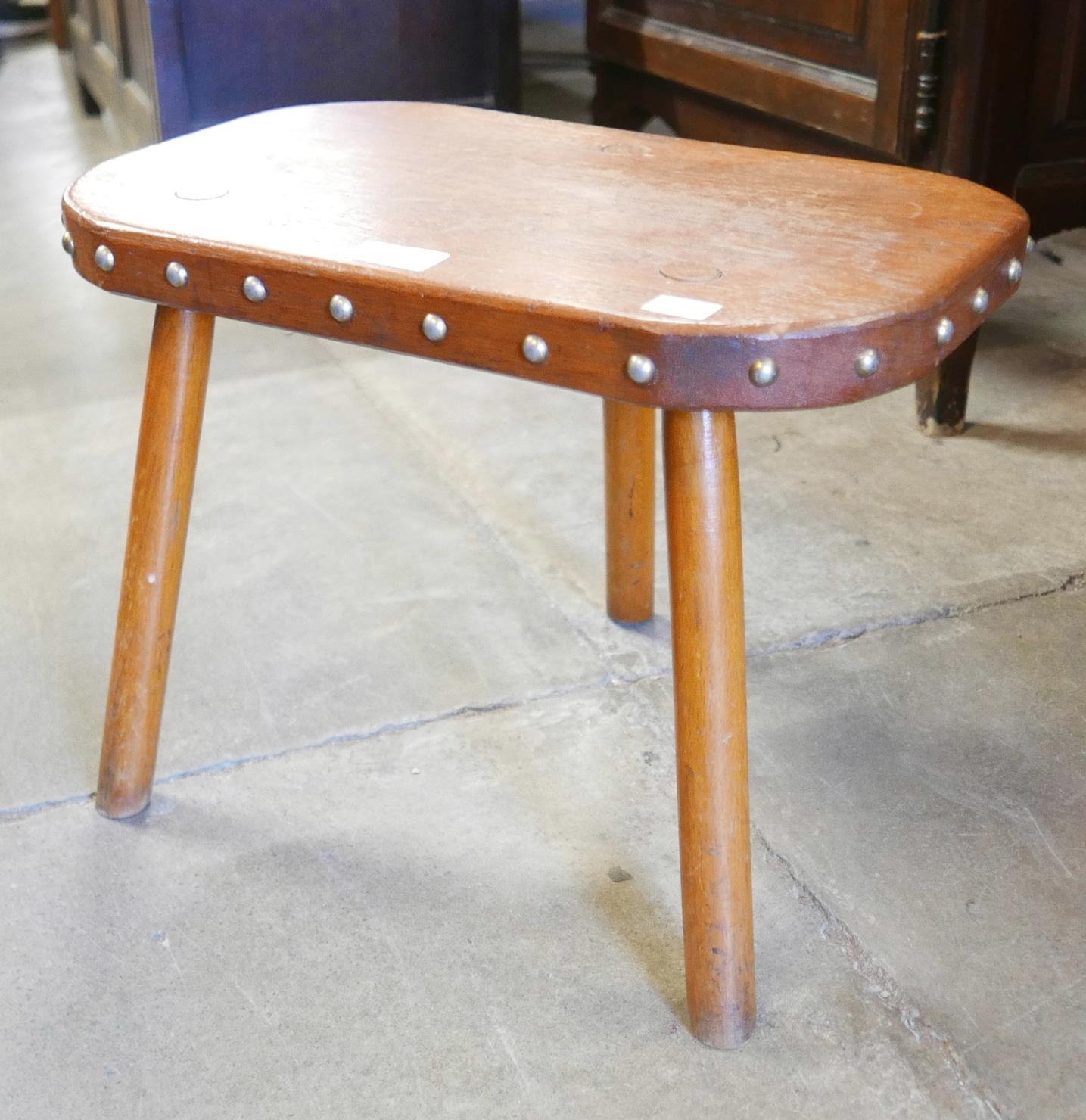 A small Victorian oak three leg kitchen stool