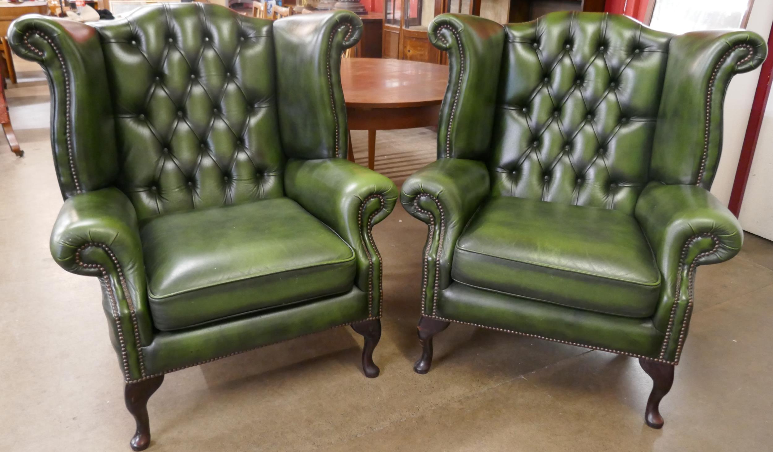 A pair of green leather Chesterfield wingback armchairs - Image 2 of 2