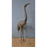 A large bronze garden figure of a crane