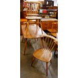 An Ercol elm and beech Windsor drop leaf table and four chairs