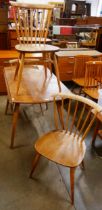 An Ercol elm and beech Windsor drop leaf table and four chairs