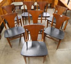 A set of eight teak and black vinyl dining chairs