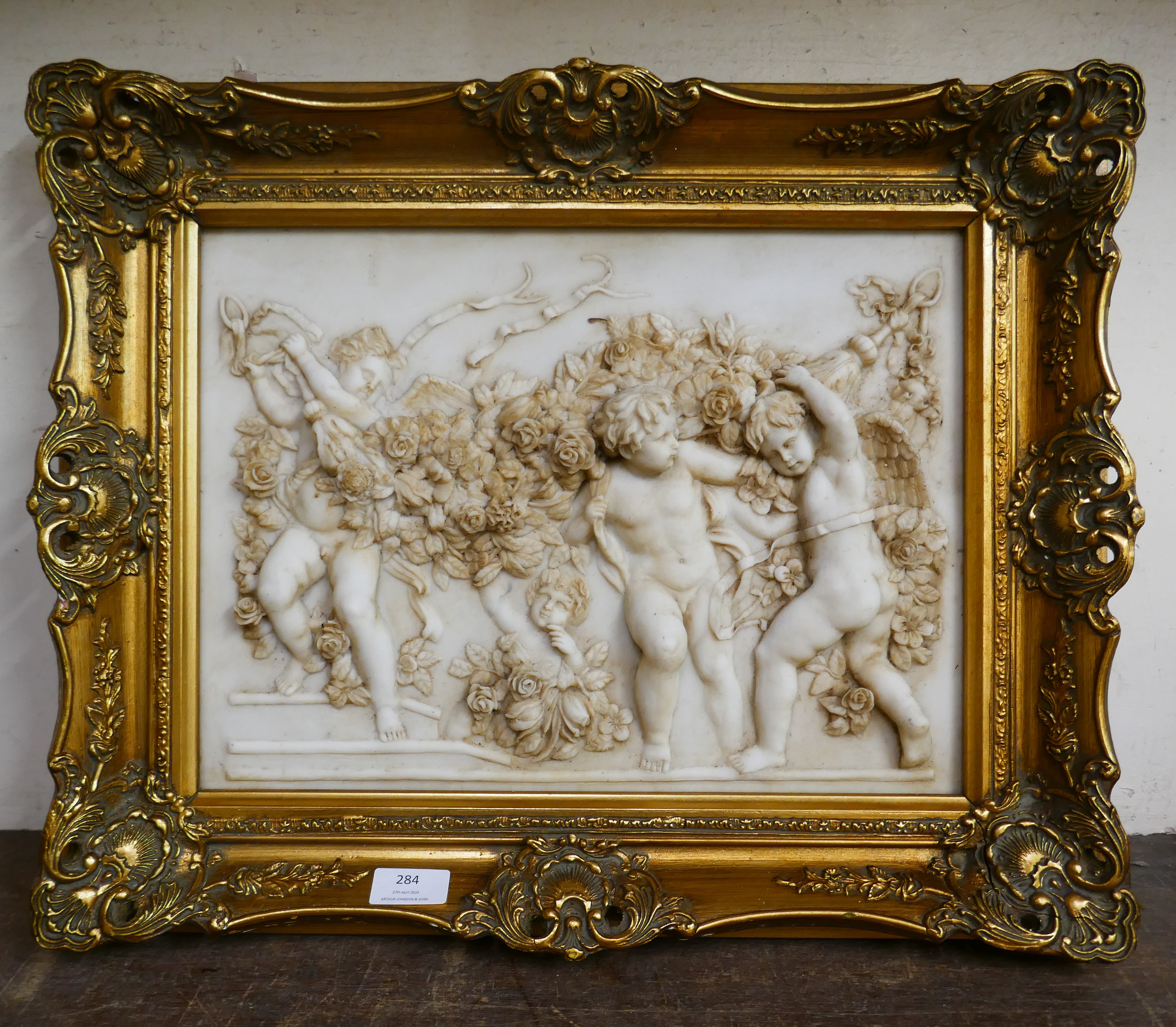A gilt framed French style faux marble plaque