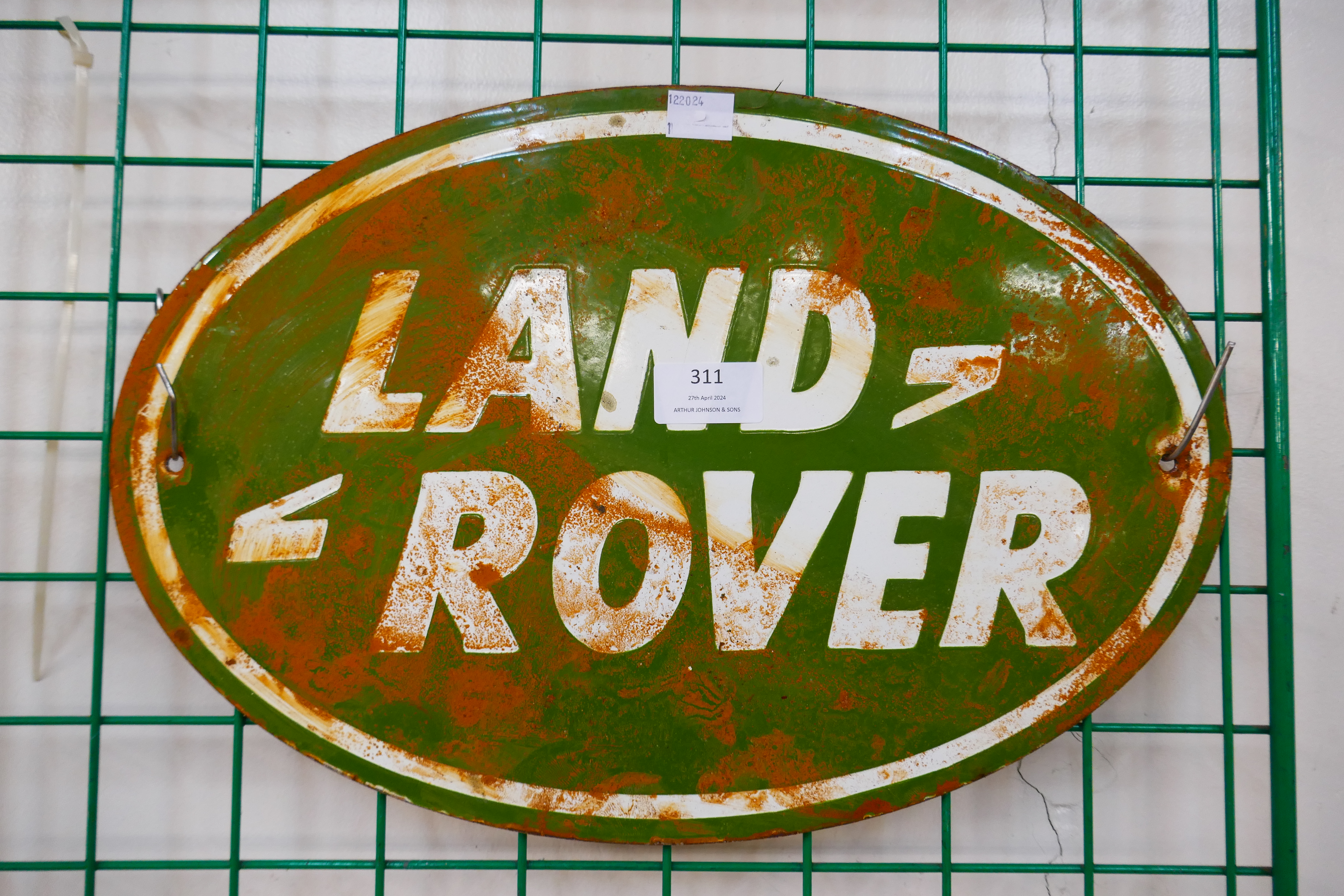 An enamelled metal Land Rover sign