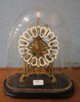 A glass domed gilt metal fusee skeleton clock