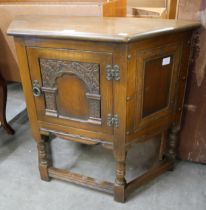 An Old Charm carved oak credence cupboard