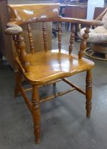 A Victorian elm and beech smokers bow chair