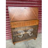 A teak cocktail cabinet