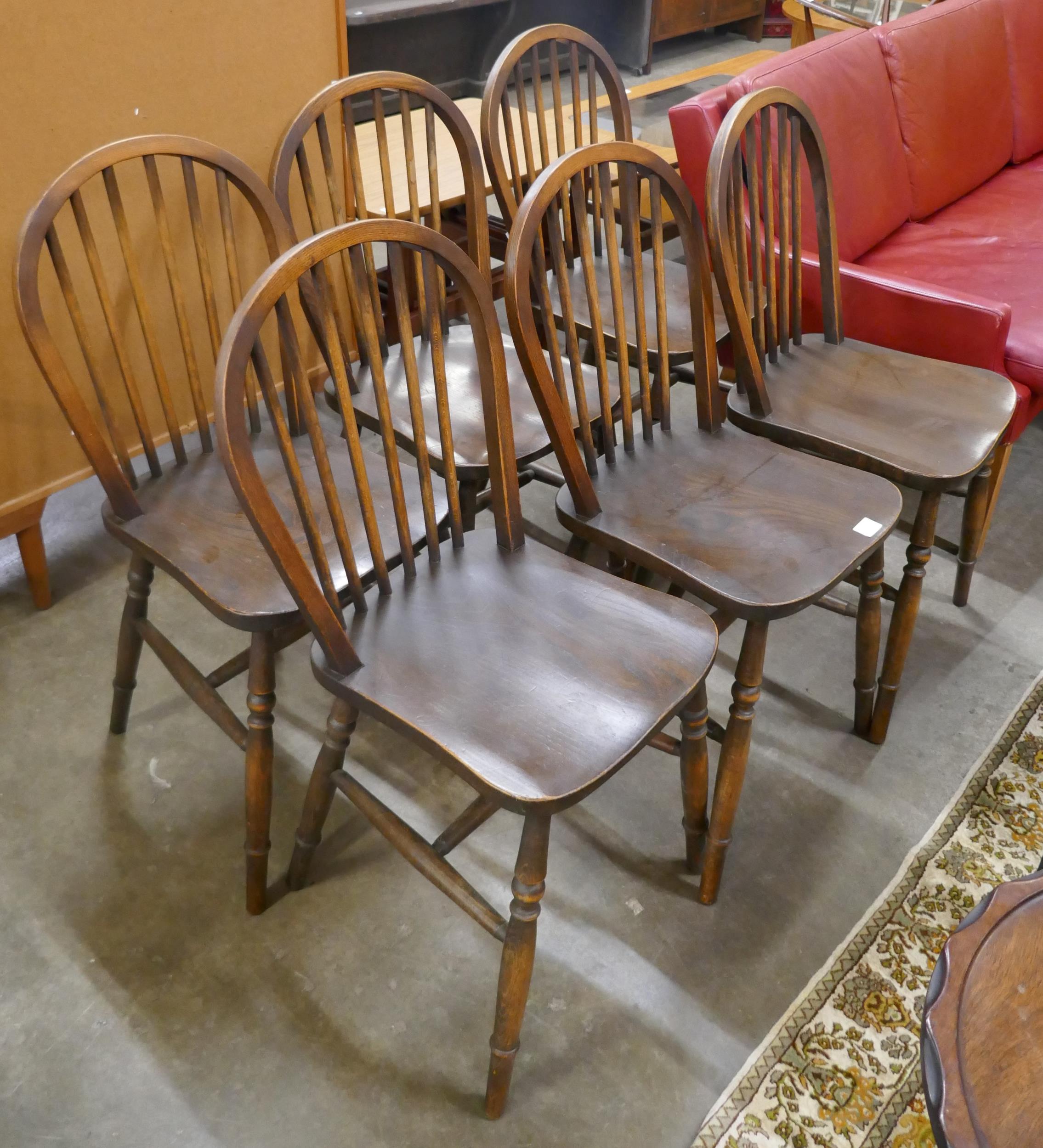 A set of six early 20th Century elm and beech Windsor kitchen chairs