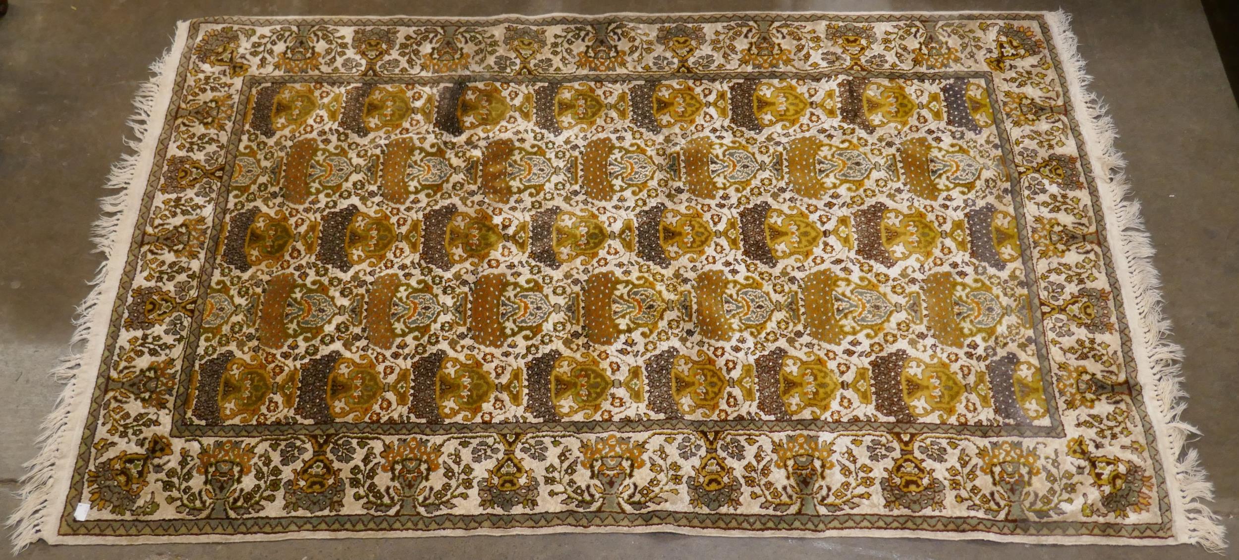 A small Kashmiri cream ground rug