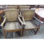 A set of four oak elbow chairs