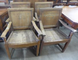 A set of four oak elbow chairs