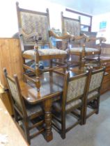 A carved oak dining table and set of six carved oak dining chairs