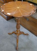 A Regency style carved walnut tripod table