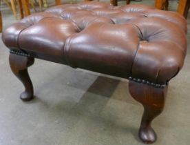 A brown leather Chesterfield footstool