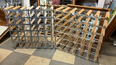 A pair of wooden and metal wine racks