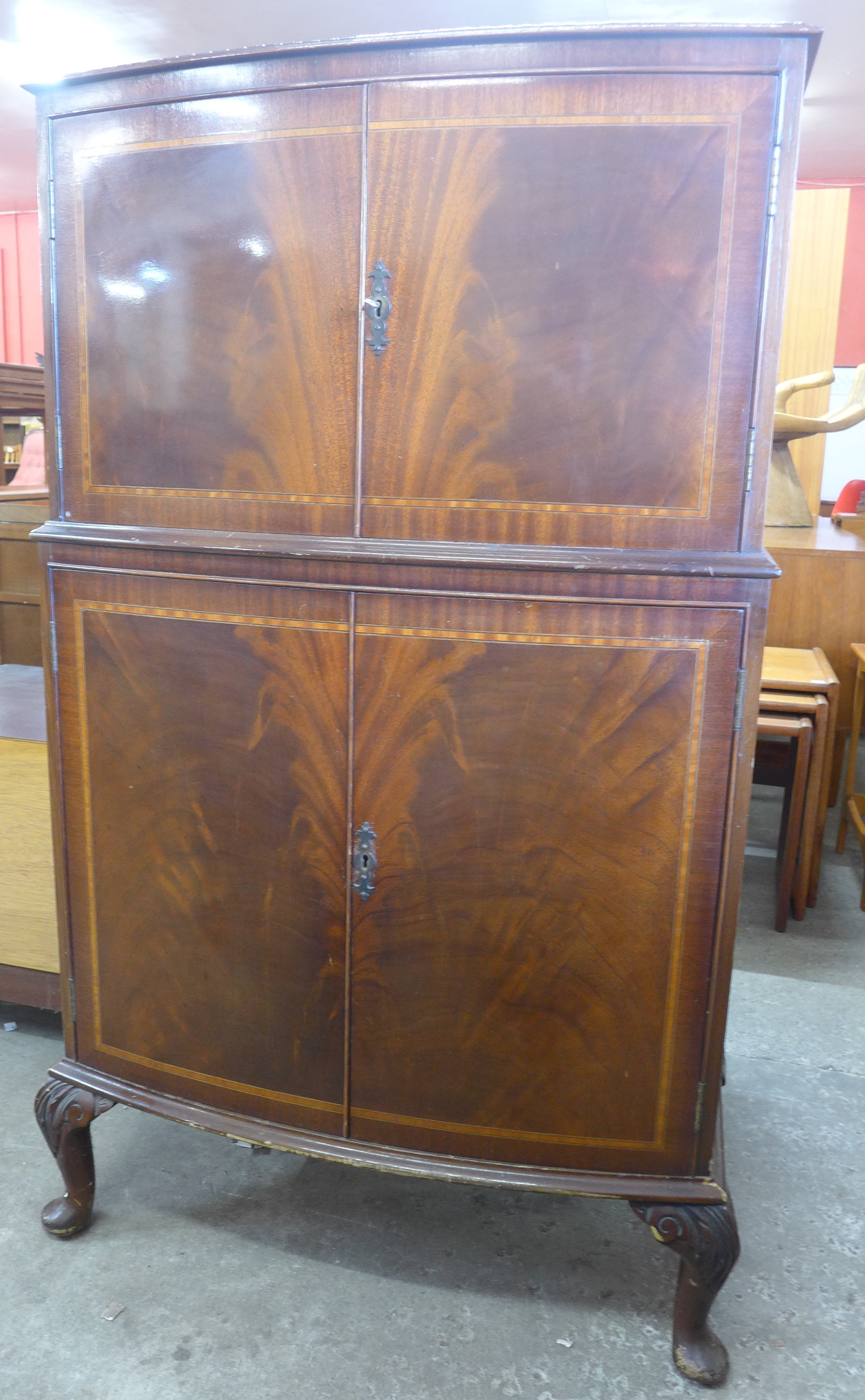 An inlaid mahogany bow front cocktail cabinet