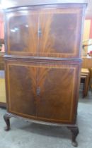 An inlaid mahogany bow front cocktail cabinet