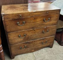 A George III mahogany chest of drawers, with brushing slide