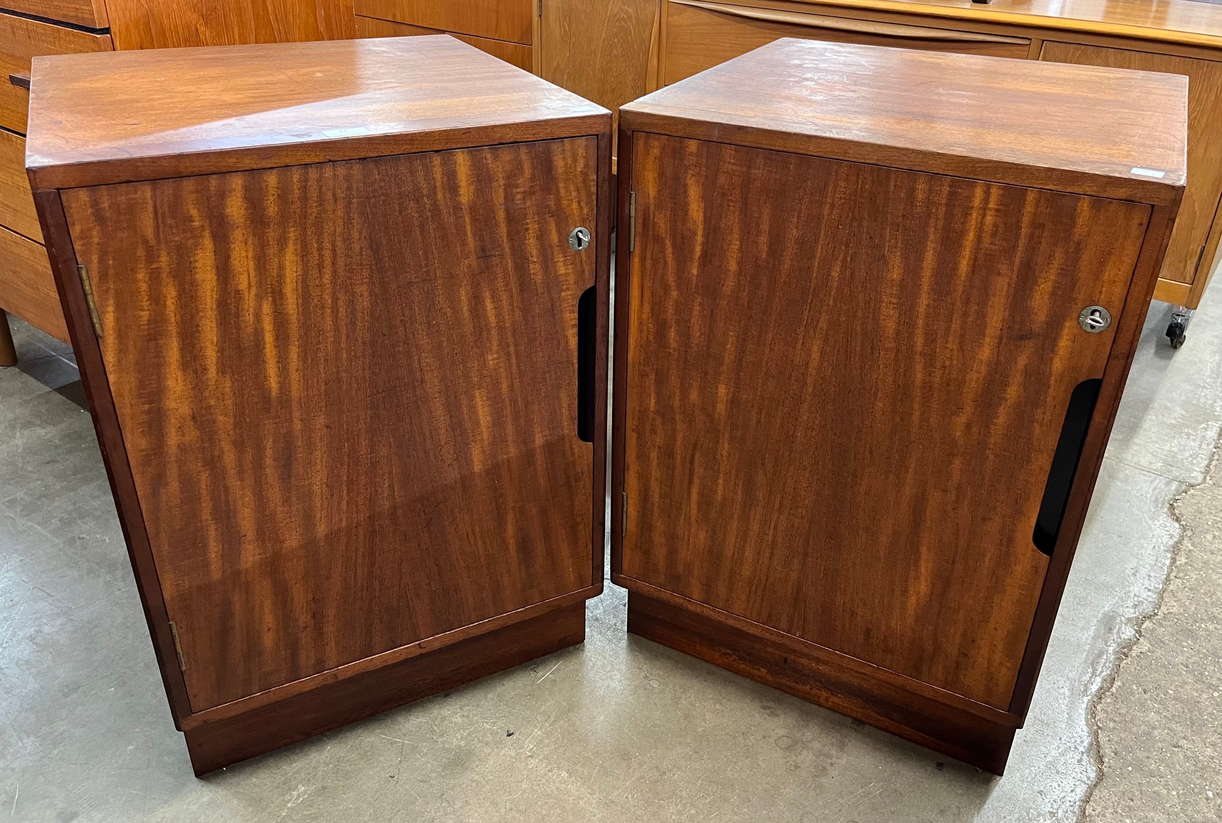 A pair of teak cabinets