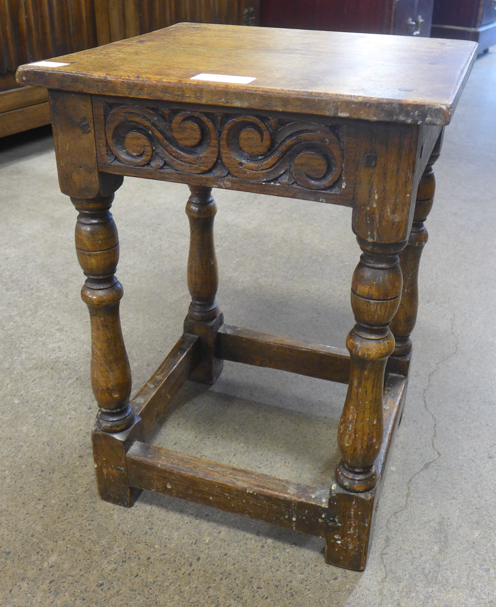 An Old Charm carved oak stool