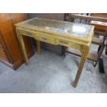 An Oriental carved hardwood console table