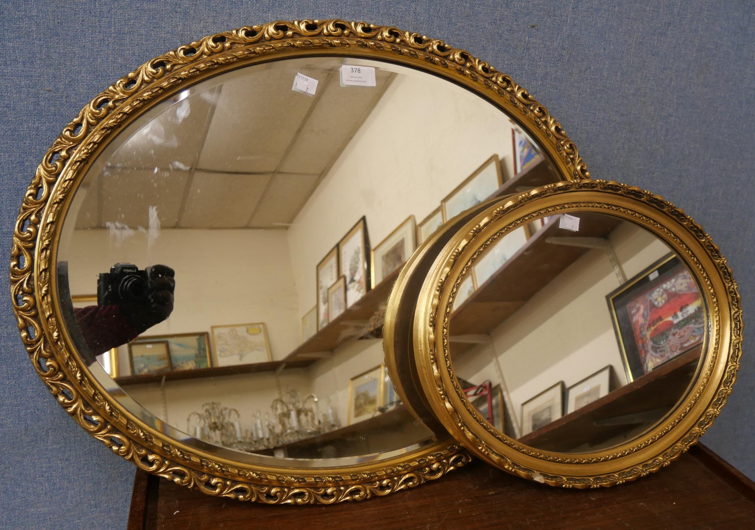 Two oval gilt framed mirrors