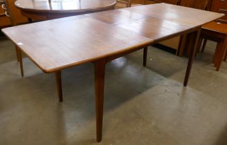 A Danish teak extending dining table